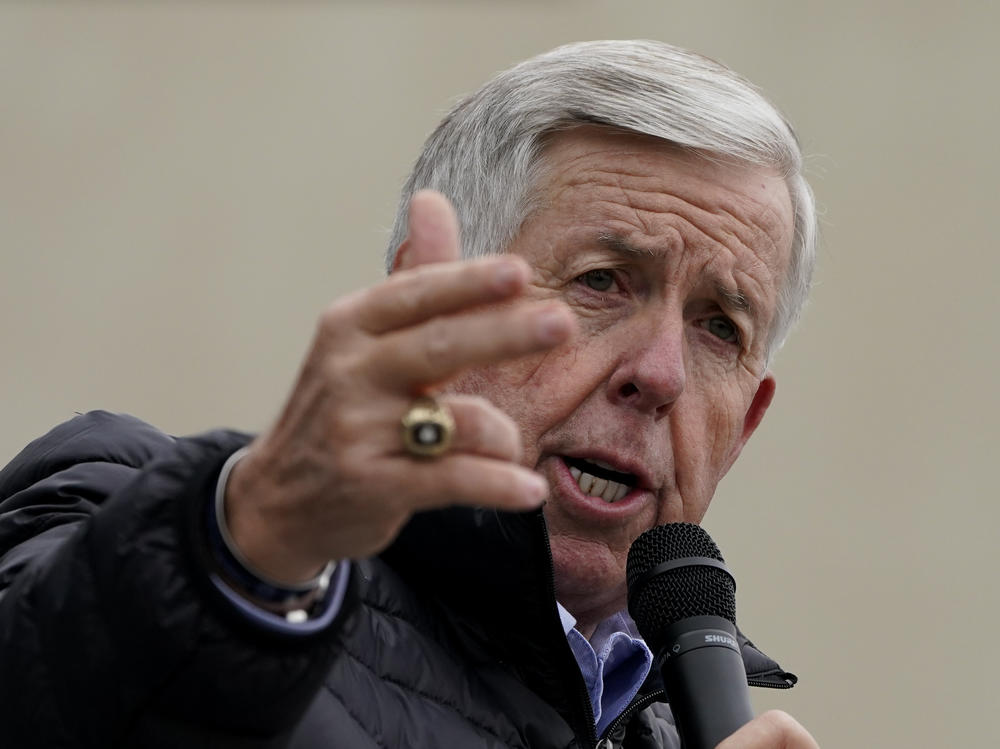 Missouri Gov. Mike Parson speaks at a campaign rally at a gun store in October in Lee's Summit, Mo. Parson has signed into law a measure that could fine state and local law enforcement officers $50,000 for helping to enforce federal gun laws.