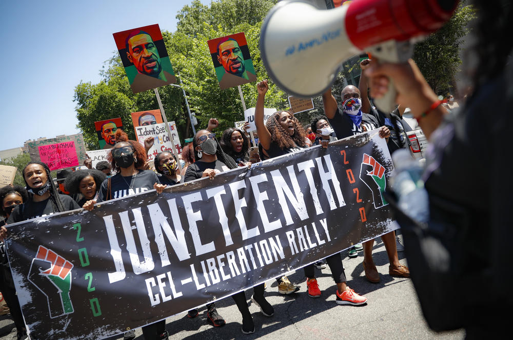 Protesters chant last year as they march after a Juneteenth rally at the Brooklyn Museum in New York City.