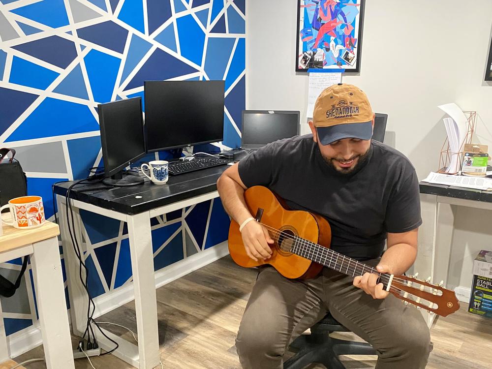 When he gets tired of looking at his screens, software developer Jonathan Caballero picks up a guitar he keeps next to his desk. Playing the guitar brought him cheer in the pandemic.
