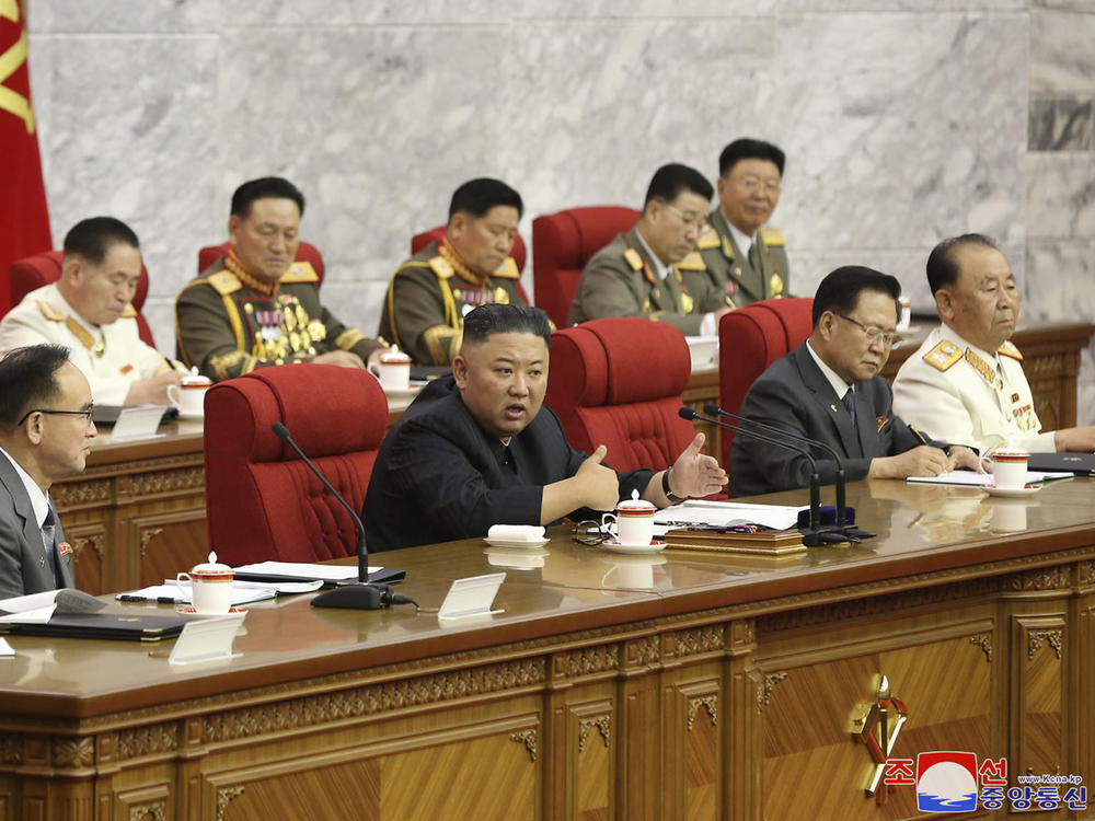 In this photo provided by the North Korean government, North Korean leader Kim Jong Un, center, speaks during a Workers' Party meeting Thursday in Pyongyang. Kim ordered his government to be fully prepared for confrontation with the Biden administration, state media reported Friday, days after the U.S. and other major powers urged the North to abandon its nuclear program and return to talks.