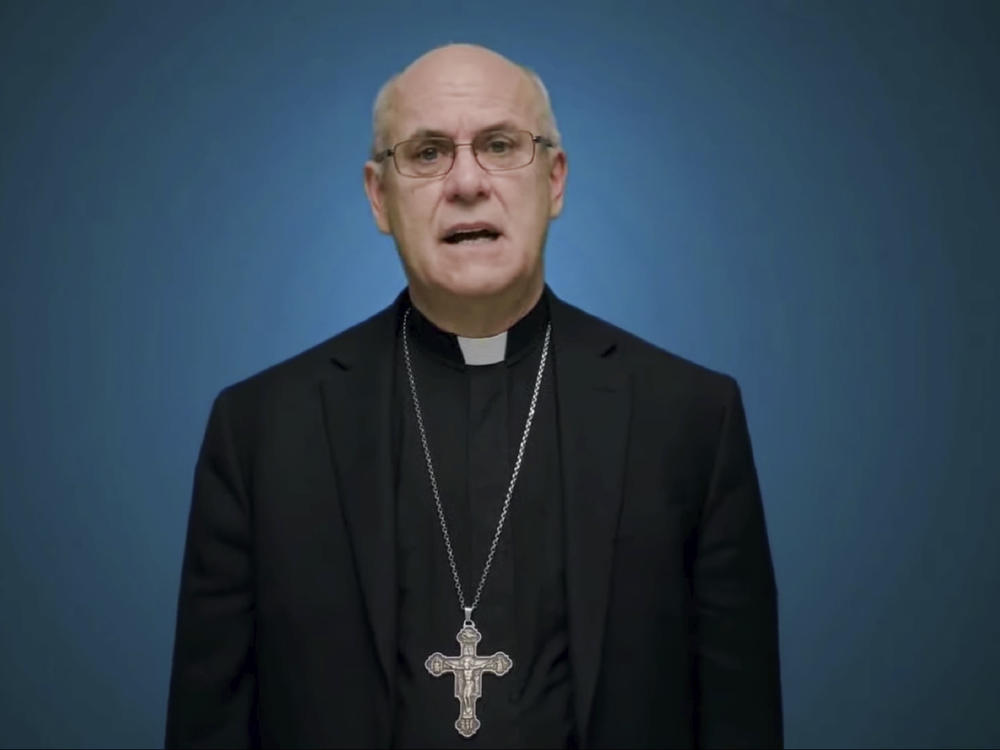 In this photo taken from video, Bishop Kevin Rhoades of Fort Wayne-South Bend, Ind., head of the doctrine committee for the U.S Conference of Catholic Bishops, addresses the body's virtual assembly regarding a formal statement on the meaning of the Eucharist in the life of the church on Thursday.