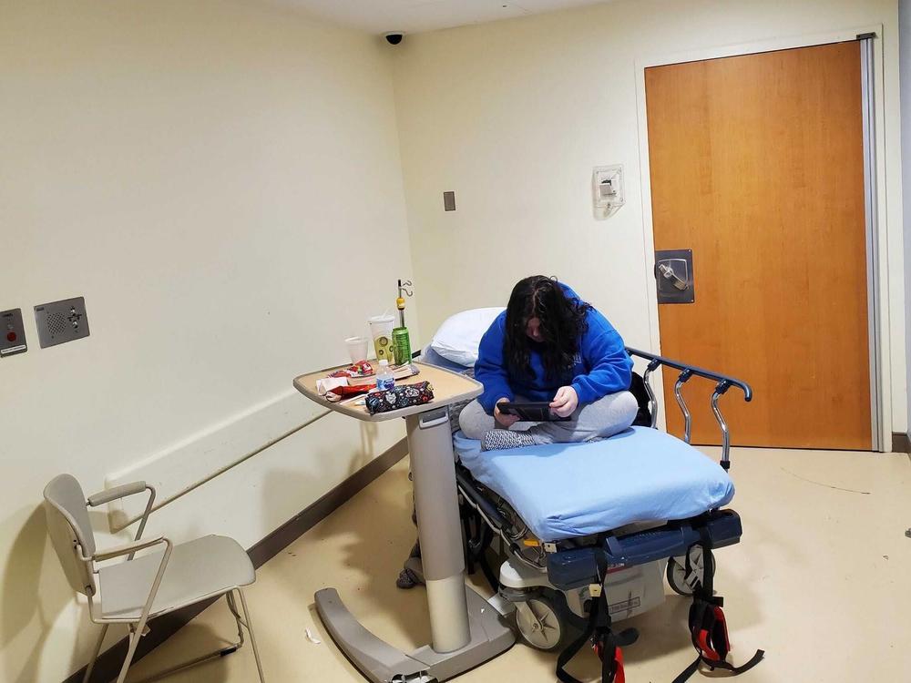 For days on end, Melinda sat and slept in this small, windowless room off the ER, waiting for a spot in a hospital psychiatric care unit to open up. After she tried to escape one day, doctors told her she could only leave the room to use the bathroom.