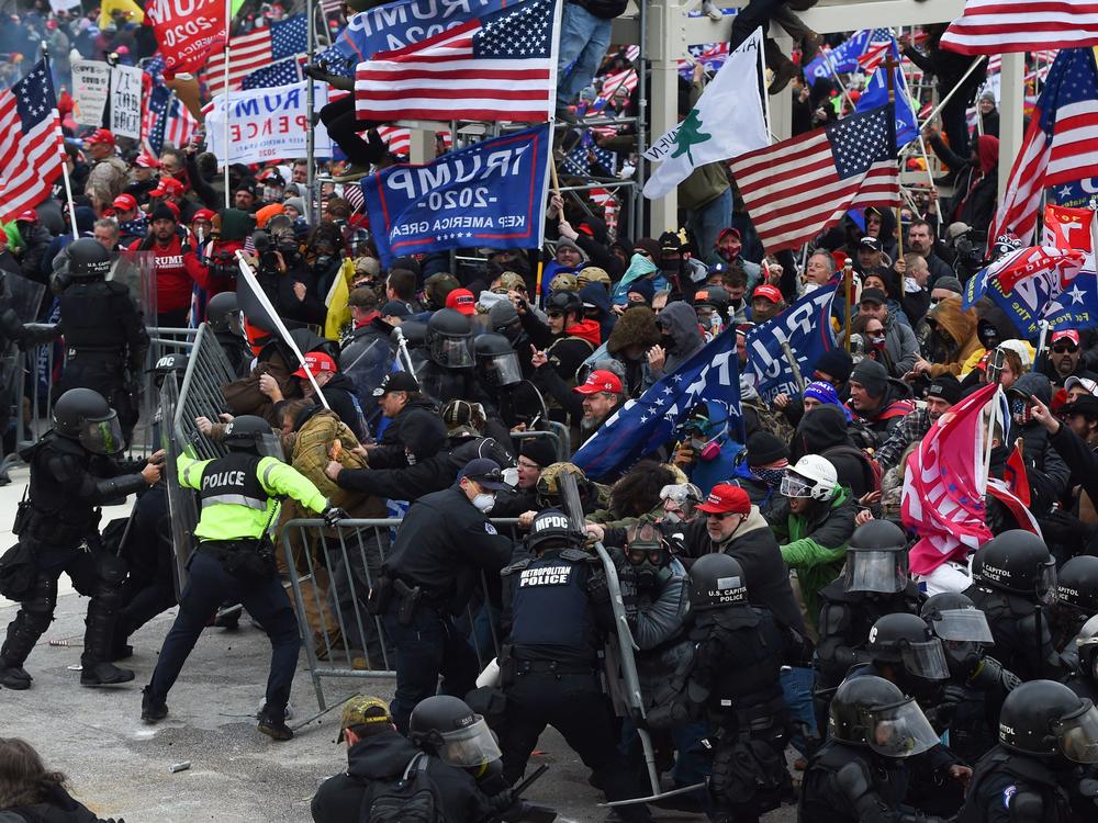 Rioters clash with police as they push barricades to storm the U.S. Capitol on Jan. 6, 2021.