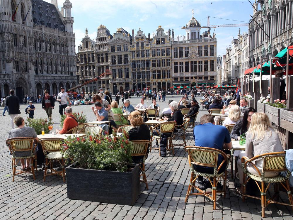 People enjoy the May sunshine from the cafe terraces of Brussels' Grand Place. On Friday, European Union added the United States to the list of countries whose citizens and residents should be allowed to travel freely within the bloc.