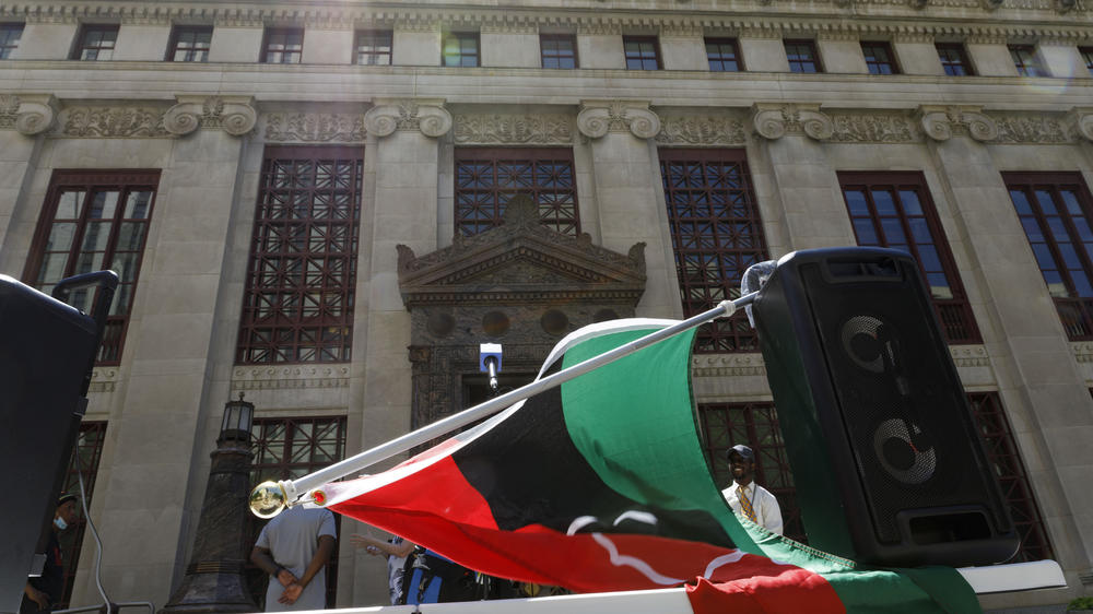 A Pan-African flag is draped over speakers at a press conference about Juneteenth held by DaVante Goins in front of the Columbus, Ohio city hall on June 17, 2021.