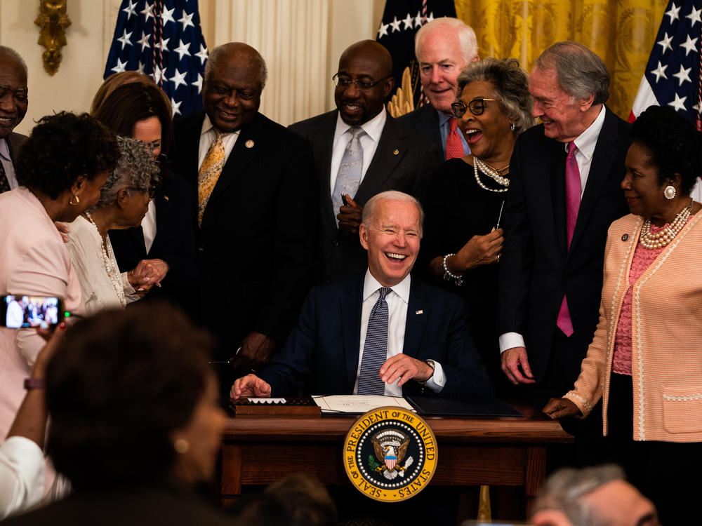 President Joe Biden is joined by Vice President Kamala Harris and members of Congress at the signing the Juneteenth National Independence Day Act into law in the East Room of the White House on June 17, 2021.