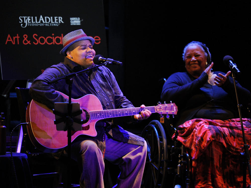 As Toni Morrison looks on, Toshi Reagon performs during an Art & Social Activism discussion on Broadway in June 2016.
