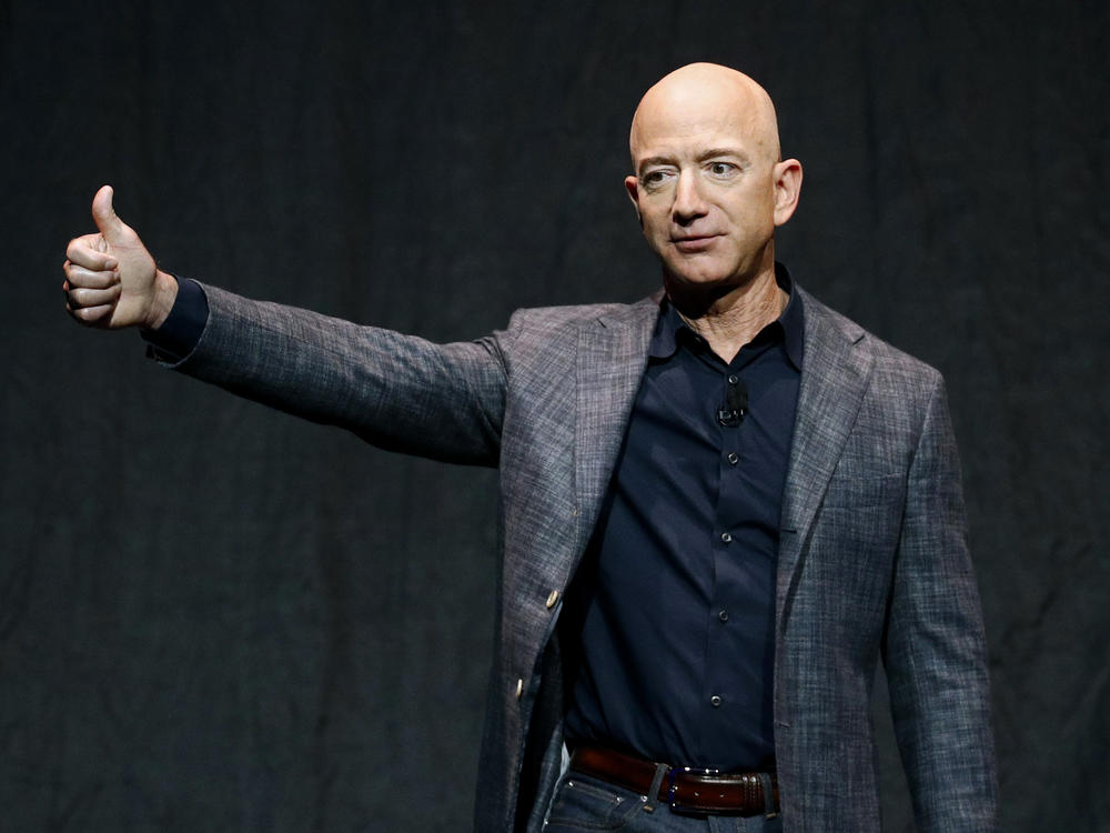 Jeff Bezos will join his brother Mark, one paying auction winner and another unnamed person on the Blue Origin rocket bound for space in July.