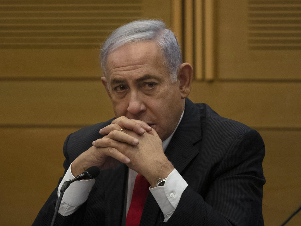 Former Israeli Prime Minister Benjamin Netanyahu speaks to right-wing opposition party members a day after a new government was sworn in, at the Knesset, Israel's parliament, in Jerusalem, Monday, June 14, 2021.