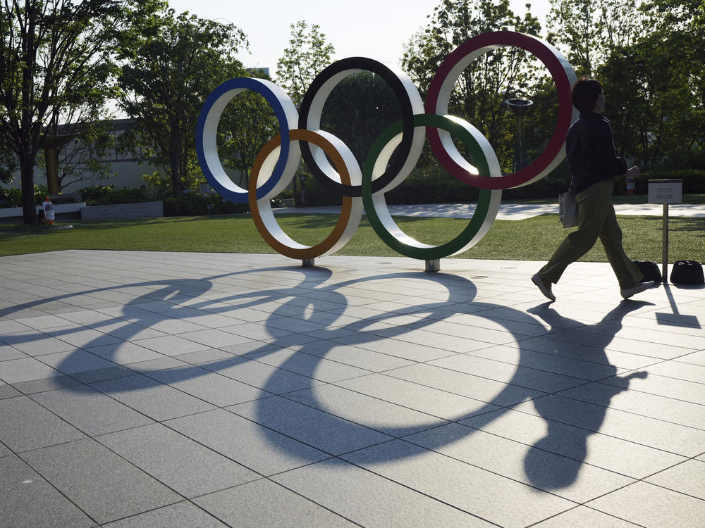 The Olympic Rings near the National Stadium in Tokyo. Critics of the decision to allow local spectators into the games warn the huge event could lead to an increase in coronavirus infections.