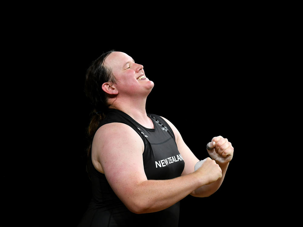 New Zealand weightlifter Laurel Hubbard celebrates completing a lift at the 2018 Commonwealth Games in Australia. Hubbard has been named to New Zealand's team at the Tokyo Olympics, making her the first openly transgender competitor at the Olympics.