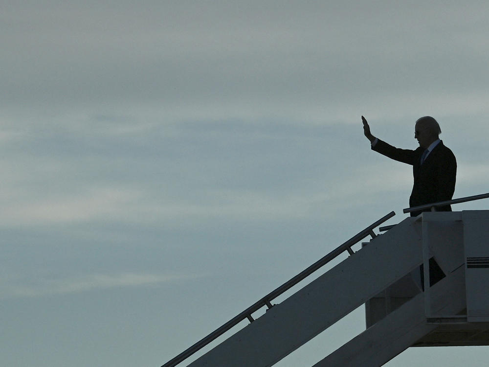 President Biden waves as he prepares to depart the airport after meeting with Russian President Vladimir Putin in Geneva, on June 16.