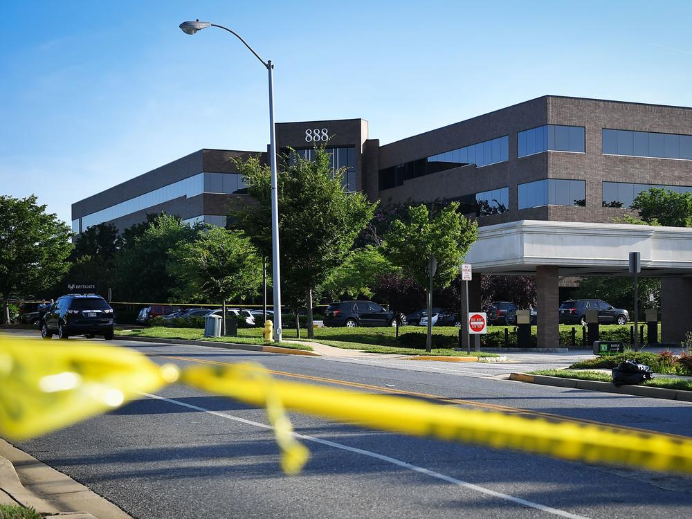 Police tape blocks access from a street leading to the building complex where the Capital Gazette is located on June 29, 2018, in Annapolis, Md. The suspect barricaded a back door in an effort to 