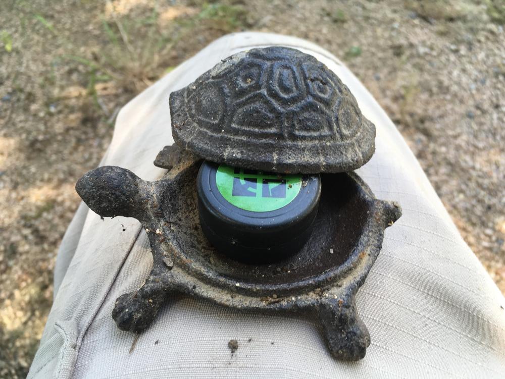 A geocache hidden inside a turtle container, that Marcellus Cadd found in Jasper, Texas.