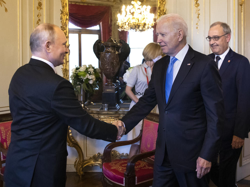U.S. President Biden and Russian President Vladimir Putin shake hands as Swiss President Guy Parmelin (right) looks on during the U.S.-Russia summit at Villa La Grange on June 16 in Geneva, Switzerland.
