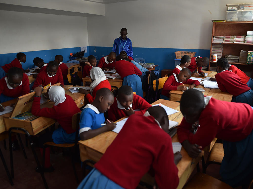 Students work on a classroom exercise at a school in Kibera, a poor neighborhood in Nairobi, Kenya.