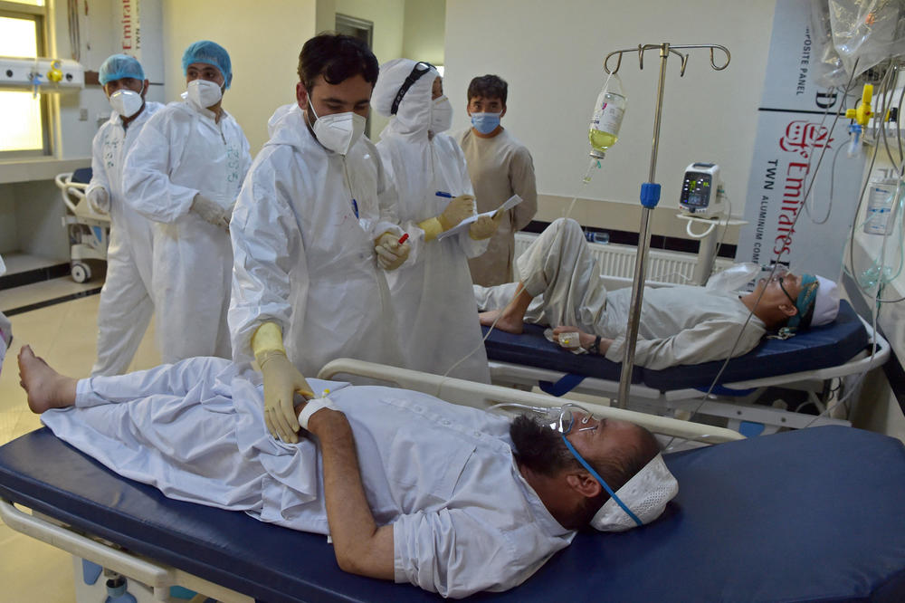 Medical personnel treat COVID-19 patients in June in the intensive care unit at Muhammad Ali Jinnah Hospital in Kabul, Afghanistan.