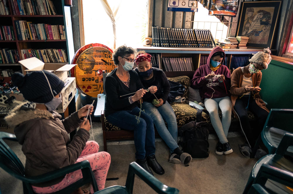 Kids learn to knit at the Hot-Spot library, which offers regular classes for the community.