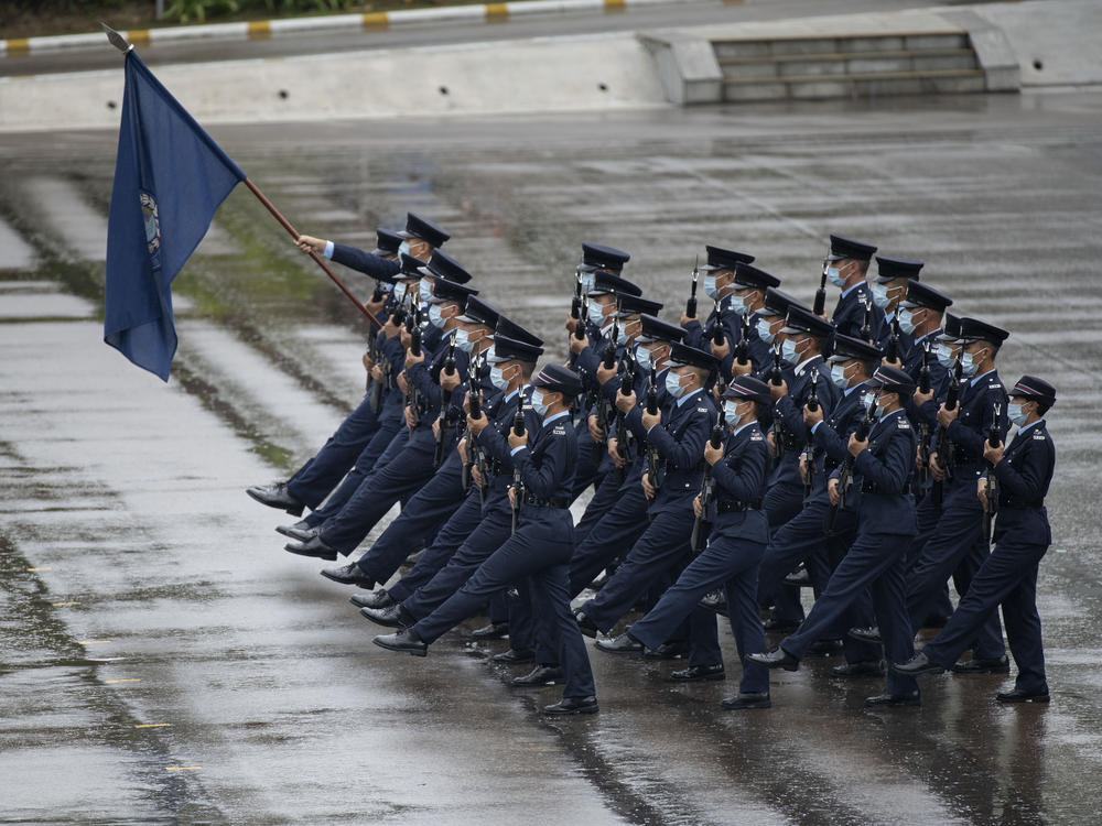 Hong Kong police show their new goose step marching style on National Security Education Day at a police school in Hong Kong on April 15.