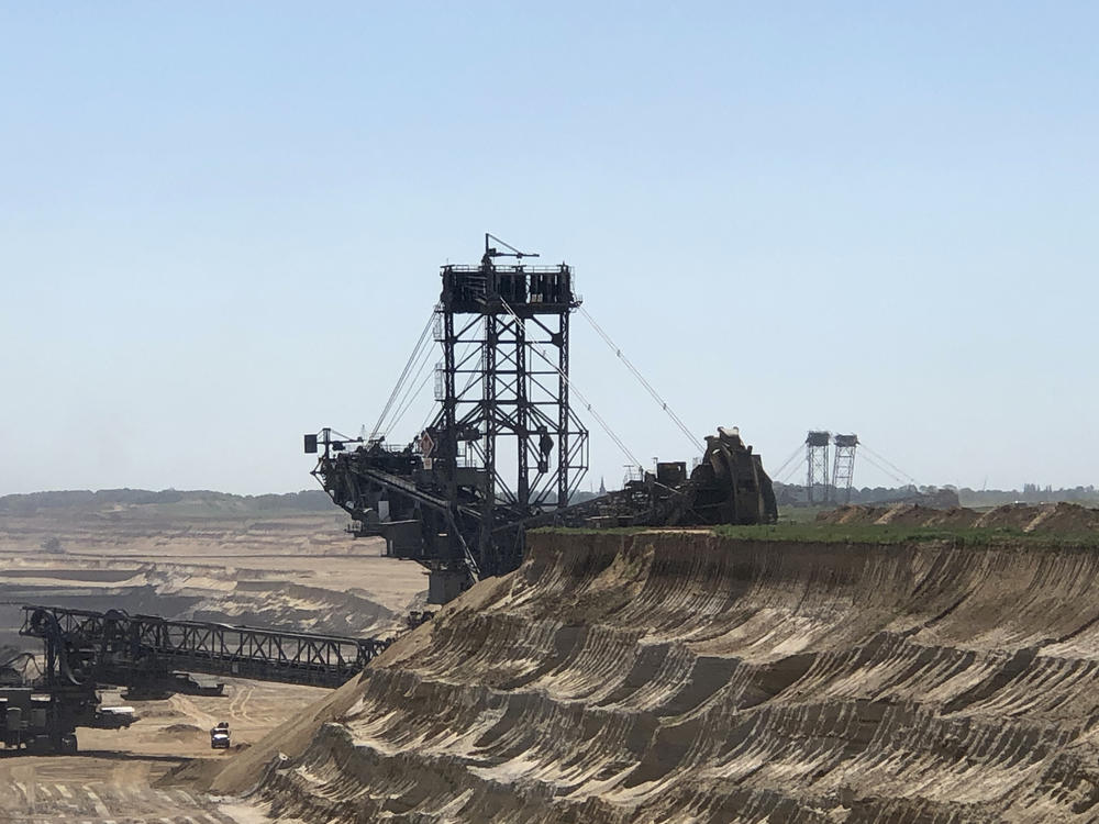 The Bagger 288, a bucket-wheel excavator, digs into the beet fields behind the farm of Norbert Winzen to expand Germany's Garzweiler coal mine, one of Europe's largest open-pit mines. Winzen's family is fighting coal mine operator RWE in an effort to save their village of Keyenberg, which is more than a thousand years old.