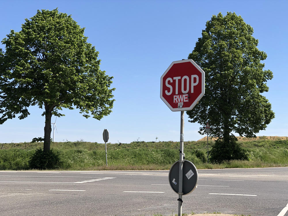 A stop sign in the village of Keyenberg shows the sentiments of some local residents toward RWE, the energy company that runs the three massive open-pit mines in this region of North Rhine-Westphalia.