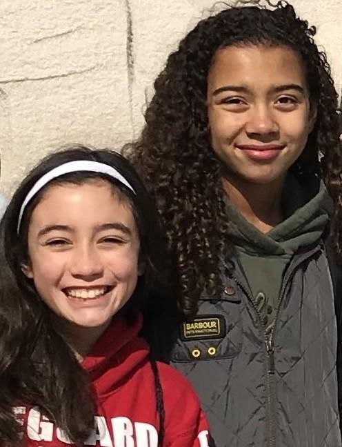 Zoe Mendis, left, and Alessia Matory, both 14, on a school field trip to Washington, D.C., in 2019. The teens helped NPR interview Charles Kenny about his new book aimed at middle-schoolers: <em>Your World, Better: Global Progress and What You Can Do About it.</em>