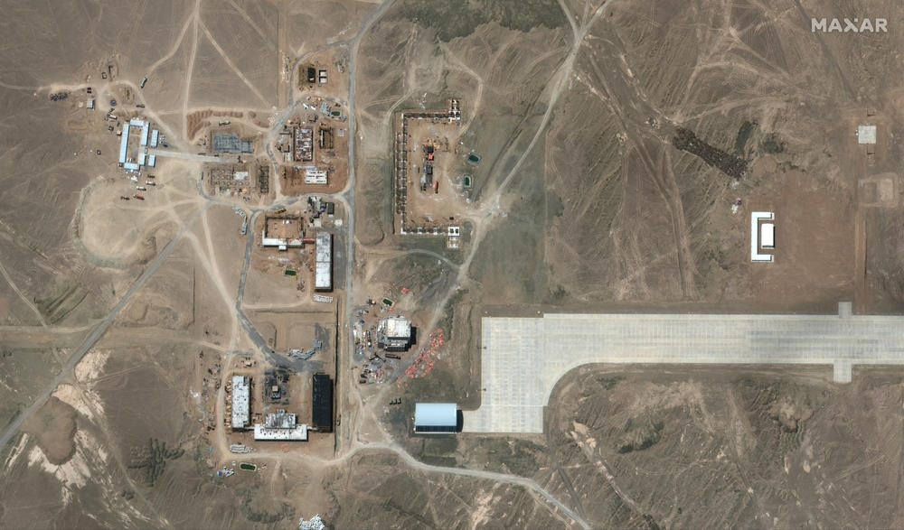 This image from June 28, 2021 shows about a dozen large buildings are under construction at the mysterious, remote airfield.