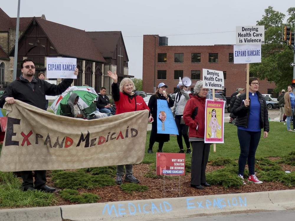 Advocates for expanding Medicaid in Kansas staged a protest outside the entrance to the statehouse parking garage in Topeka in May 2019. Today, twelve states have still not expanded Medicaid. The biggest are Texas, Florida, and Georgia, but there are a few outside the South, including Wyoming and Kansas.