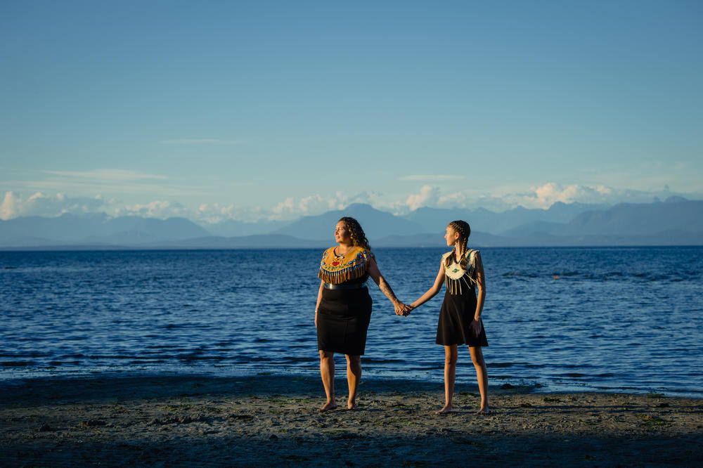 To mark her graduation, Danita Bilozaze and her daughter Dani dressed in traditional Indigenous wear. The beaded yokes, Bilozaze says, bear plants representing her native Denesuline people of Cold Lake First Nations.