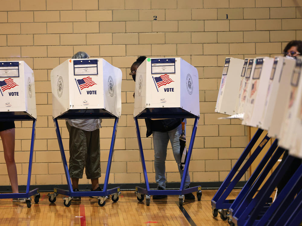People vote during the Primary Election Day at P.S. 249 The Caton School on June 22 in the Flatbush neighborhood of Brooklyn borough in New York City.