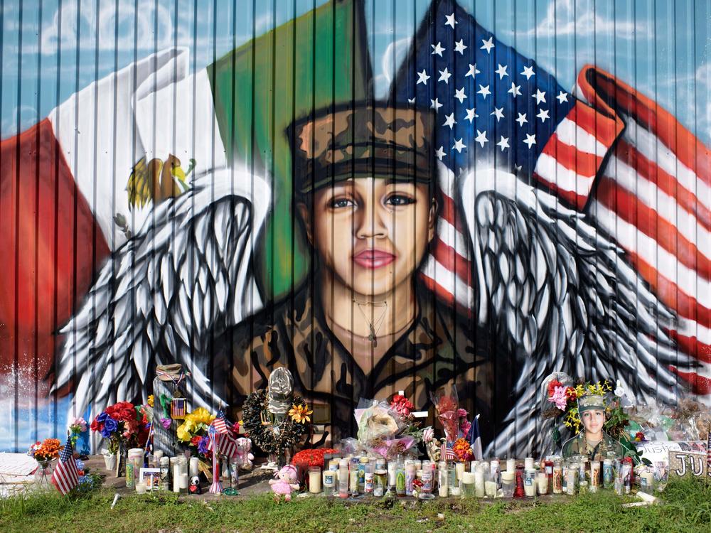 Candles and flowers decorate a makeshift memorial for Vanessa Guillén, a Fort Hood, Texas, soldier whose 2020 killing put a spotlight on sexual harassment in the U.S. military.