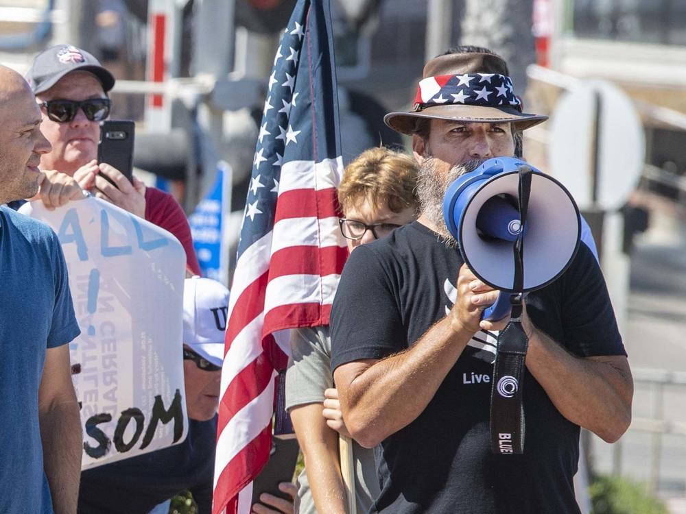 Alan Hostetter, seen here in May 2020, became a leading activist against coronavirus-related lockdown policies in Orange County, Calif. Hostetter, a former police chief and yoga instructor, is now facing conspiracy charges for his alleged role in the insurrection at the U.S. Capitol.