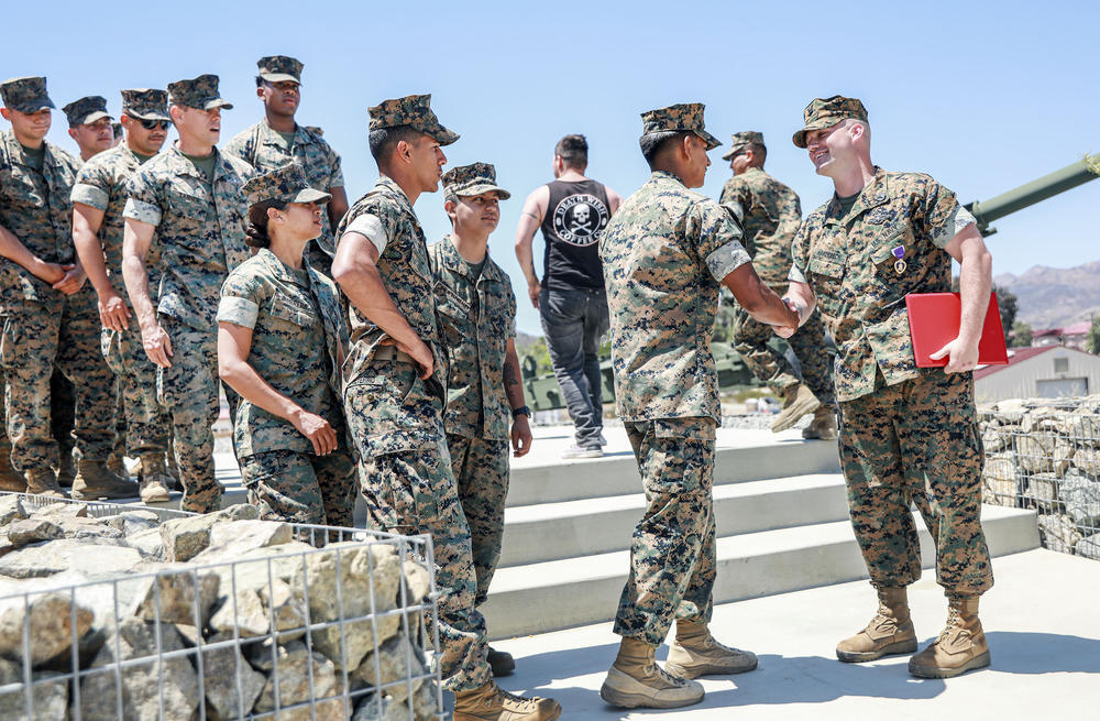 Hardebeck shakes hands with service members after the ceremony. Hardebeck's injuries for which he is being recognized took place in 2010 in Marjah, Afghanistan — one of the most dangerous cities in the country at the time.