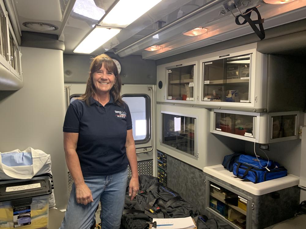 Dutton EMS Crew Chief Colleen Campbell shows off an ambulance at the Dutton ambulance barn.