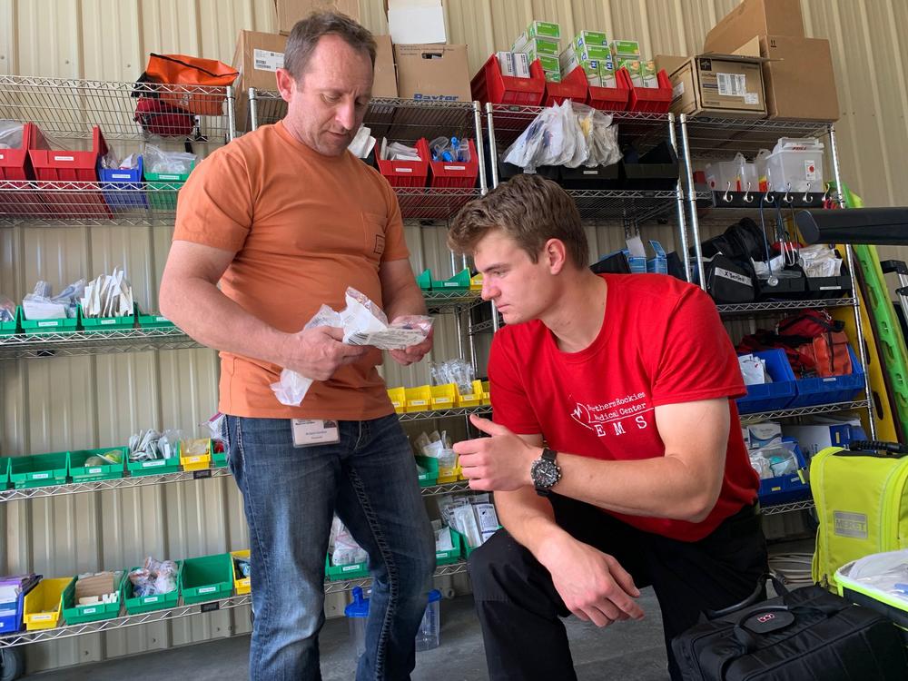 Glacier County EMS paramedic Robert Gordon, left, and EMT Camas Rinehart put together advanced life support bags for their ambulances. Glacier EMS is one of the few paid services along Montana's Rocky Mountain Front that responds when volunteer agencies can't, and provides advanced life support transfers from critical access hospitals to larger facilities miles away.