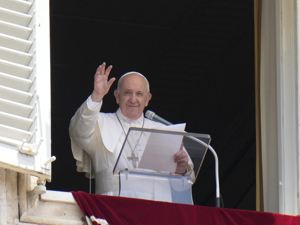 Pope Francis waves to the crowd from the window of his studio overlooking St.Peter's Square, at the Vatican. In a brief announcement Sunday afternoon the Vatican said Pope Francis has gone to a Rome hospital for scheduled surgery.