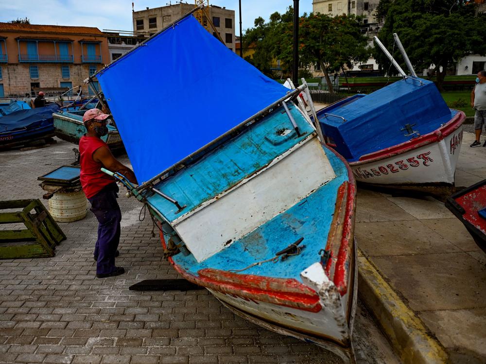 Fishermen secure their boats to land ahead of the passage of Tropical Storm Elsa in Havana, Cuba, on July 5. Elsa made landfall in Cuba and is now headed to Florida.