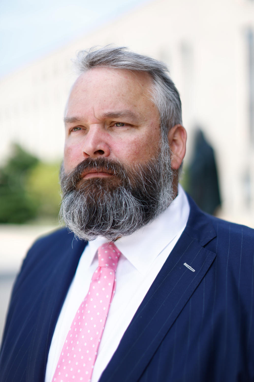 Attorney Greg Hunter stands outside the E. Barrett Prettyman U.S. Courthouse in Washington, D.C. Hunter is a defense attorney who is working on a dozen Jan. 6 cases.