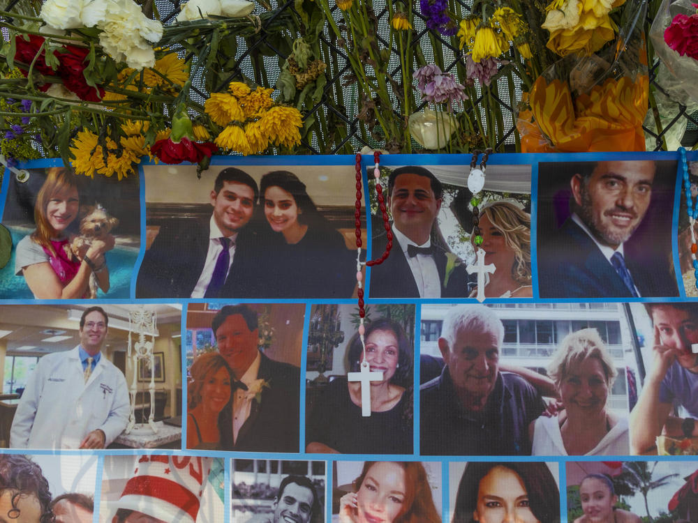 A memorial shows some of the people still missing from the Champlain Towers South condo collapse in Surfside, Fla.