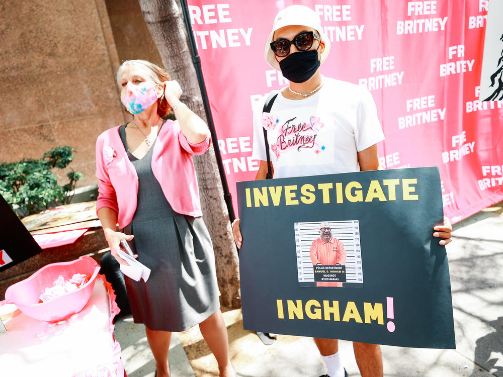 #FreeBritney activists protesting outside a Los Angeles courthouse, sporting a sign that reads 