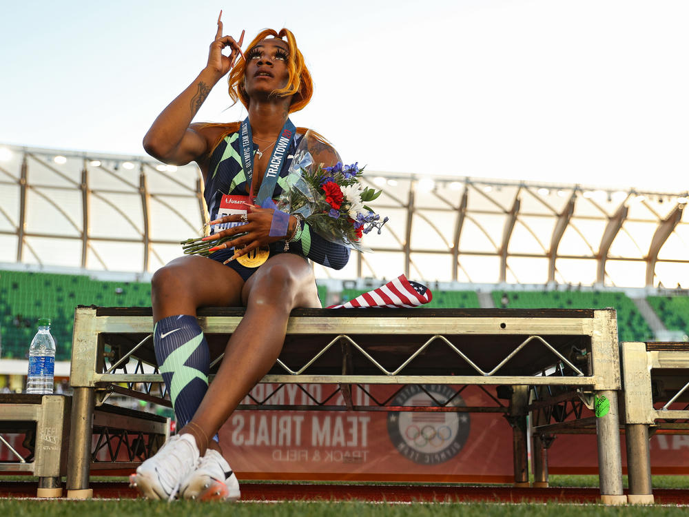 Sha'Carri Richardson points to the sky after winning the women's 100-meter final on Day 2 of the 2020 U.S. Olympic Track & Field Team Trials at Hayward Field on June 19 in Eugene, Ore.