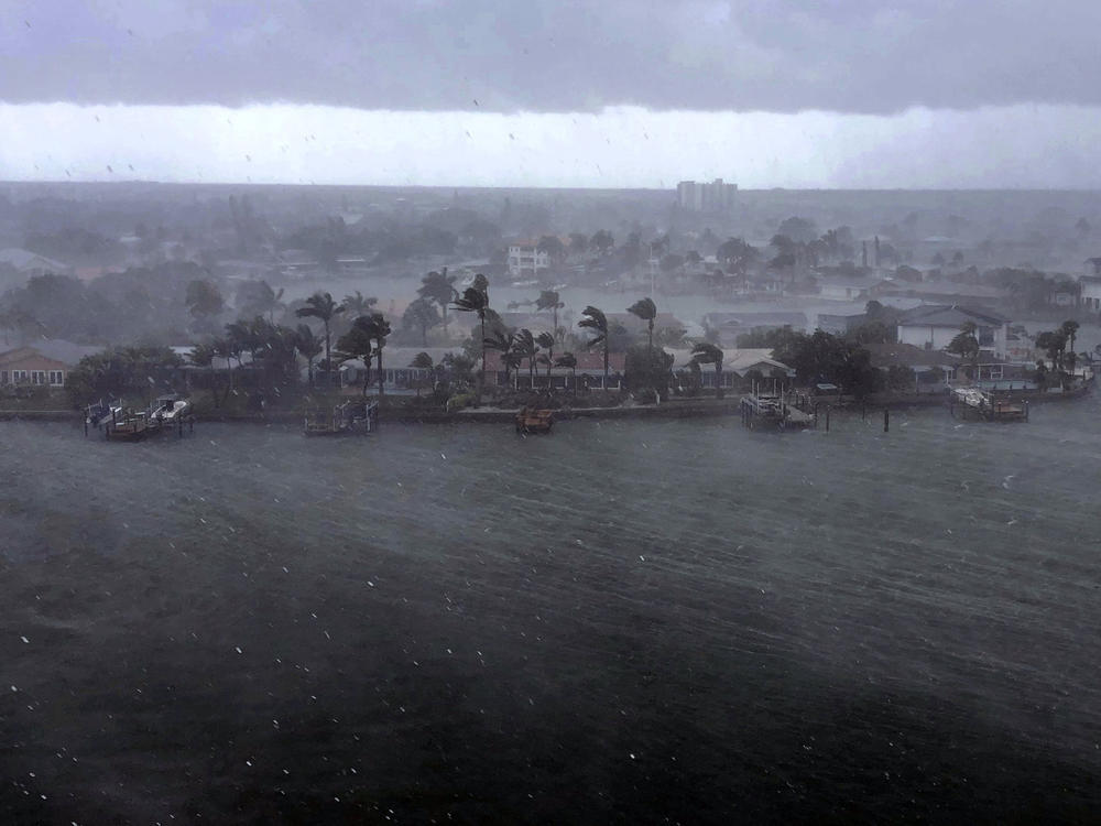 Looking north at the neighborhood of Paradise Island on Treasure Island, Fla., outer bands of Tropical Storm Elsa brings a downpour of rain over the area on Tuesday, July 6, 2021.