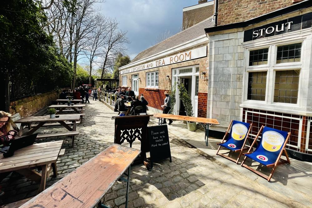 Tables begin to fill up on reopening day at the Carlton Tavern, which a developer illegally demolished in 2015 and was forced to have it rebuilt as a near-perfect replica of the century-old original.