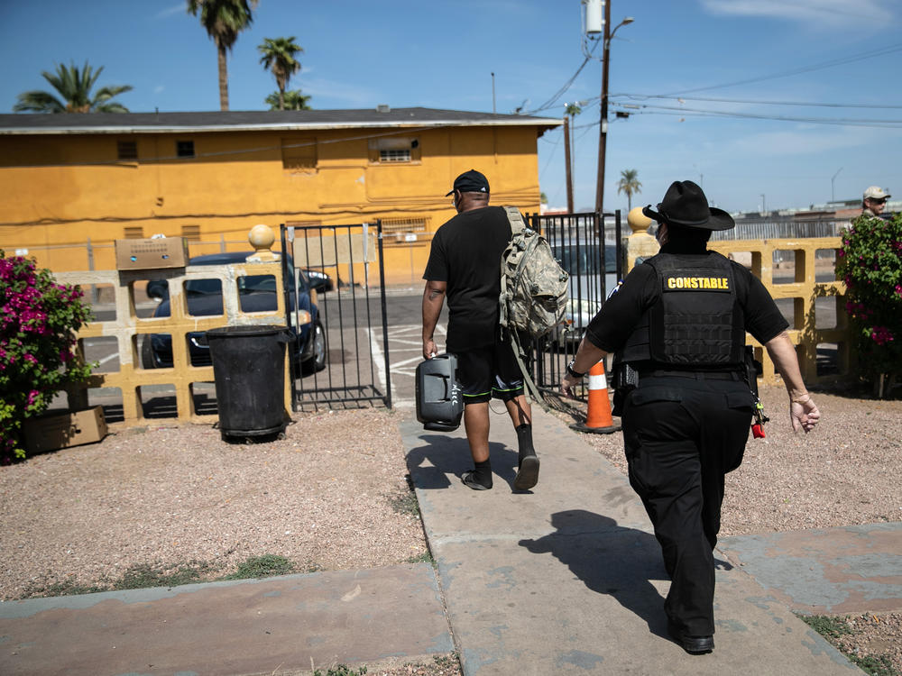 Maricopa County constable Darlene Martinez evicts a tenant on October 7, 2020 in Phoenix, Arizona. Thousands of court-ordered evictions continue nationwide despite a Centers for Disease Control (CDC) moratorium for renters impacted by the coronavirus pandemic.