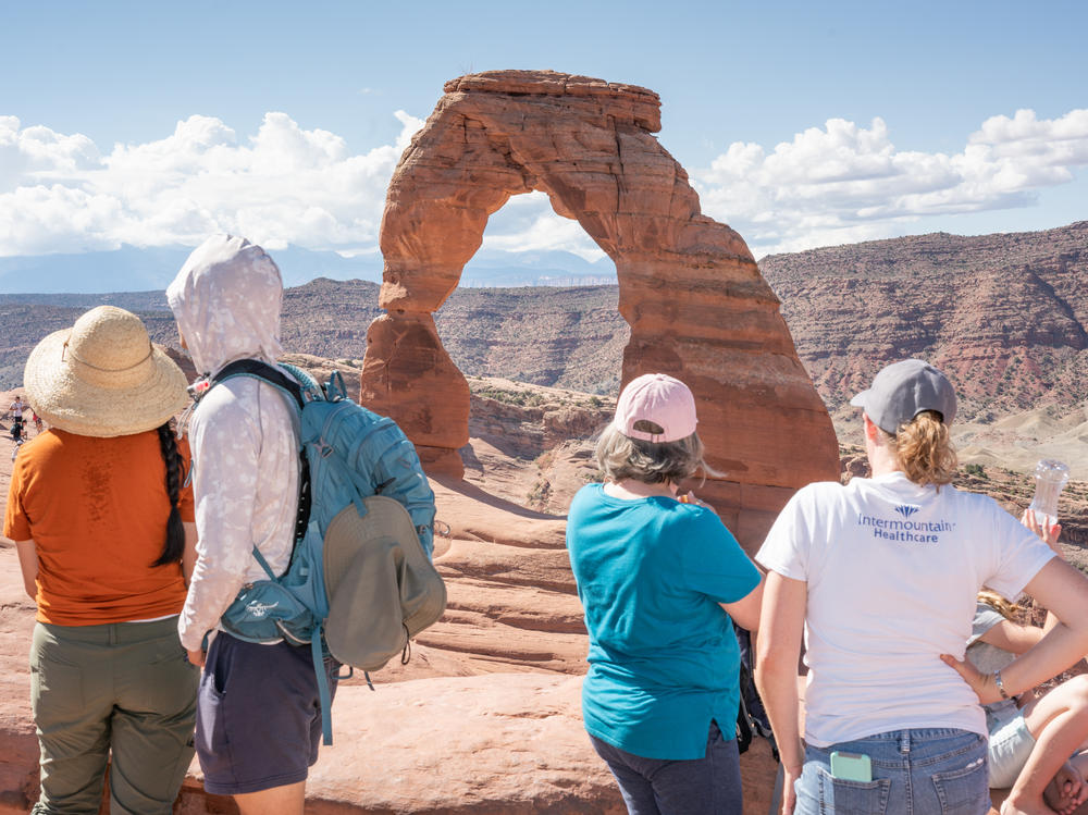 Visitors gather last week to view Delicate Arch at Arches National Park in Utah.