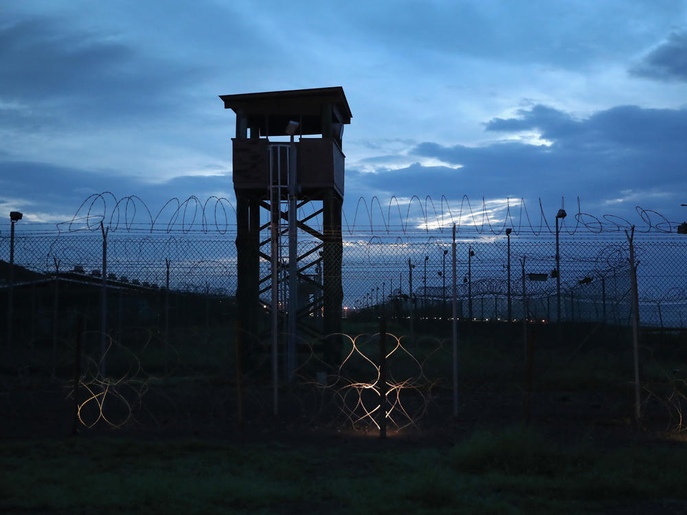 Razor wire and a guard tower stands at a closed section of the U.S. prison at Guantánamo Bay on Oct. 22, 2016.