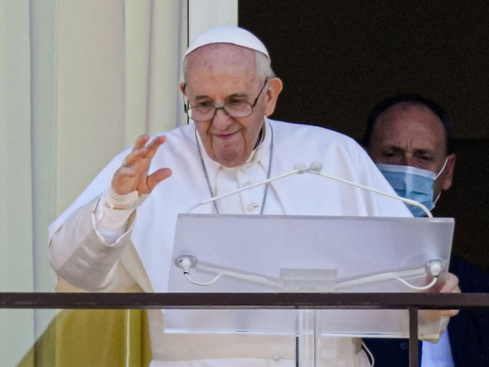 Pope Francis appears on a balcony of the Agostino Gemelli Polyclinic in Rome, Sunday, July 11, 2021, where he is recovering from intestinal surgery, for the traditional Sunday blessing and Angelus prayer. Pope Francis is 84 and had a part of his colon removed a week ago.