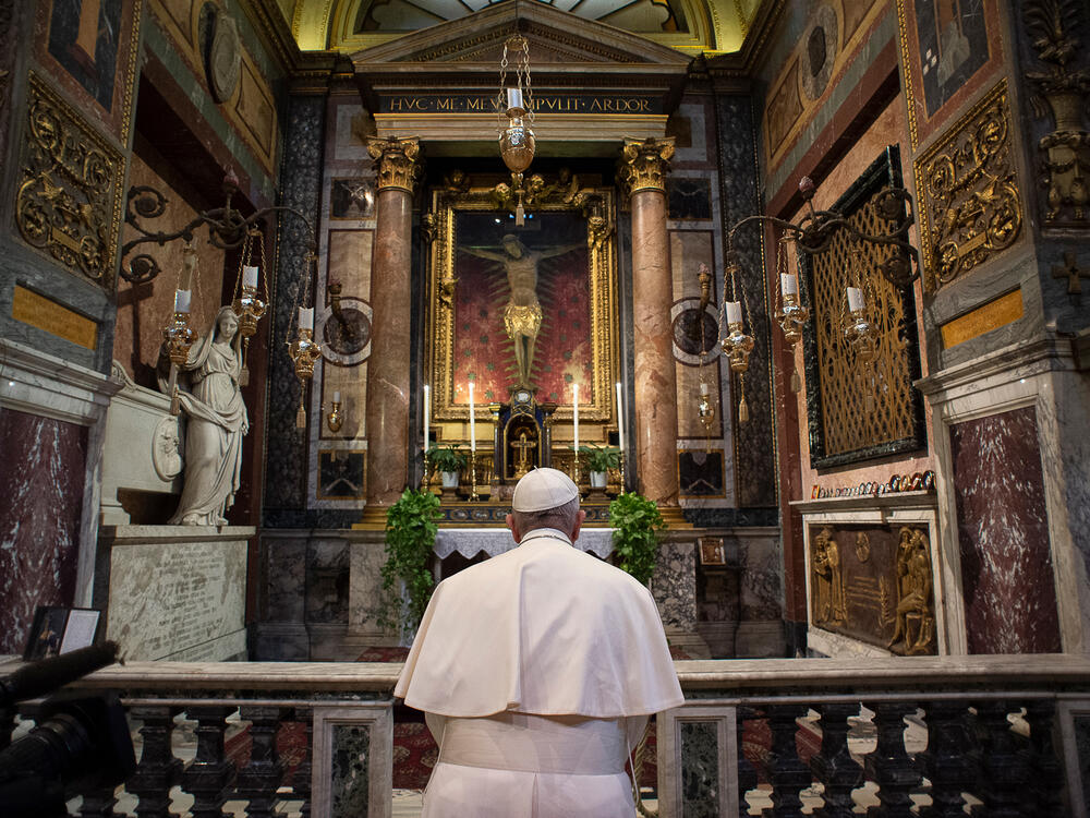 Pope Francis prays in San Marcello al Corso church in Rome on March 15, 2020.