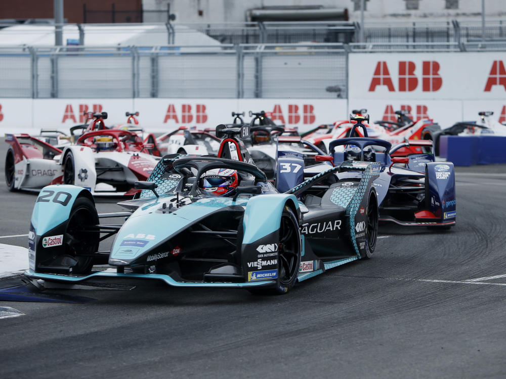 Major automakers like Jaguar develop all-electric race cars to compete in Formula E. Here Mitch Evans, in a Jaguar, leads rivals during the ABB FIA Formula E Championship in New York City on July 11.