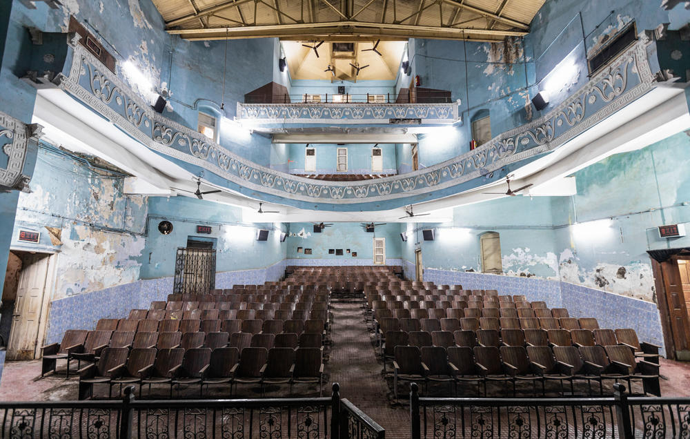 A view of the Edward Theatre in Mumbai from the vantage point of its stage and screen. Between 2010 and 2019, the number of single-screen cinemas across India dwindled from about 10,000 to less than 7,000. Dozens more have announced they're shutting down this year after a deadly second wave of infections.